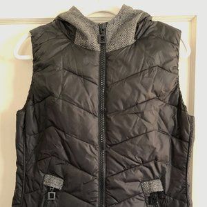 Black puffer vest with soft herringbone accents